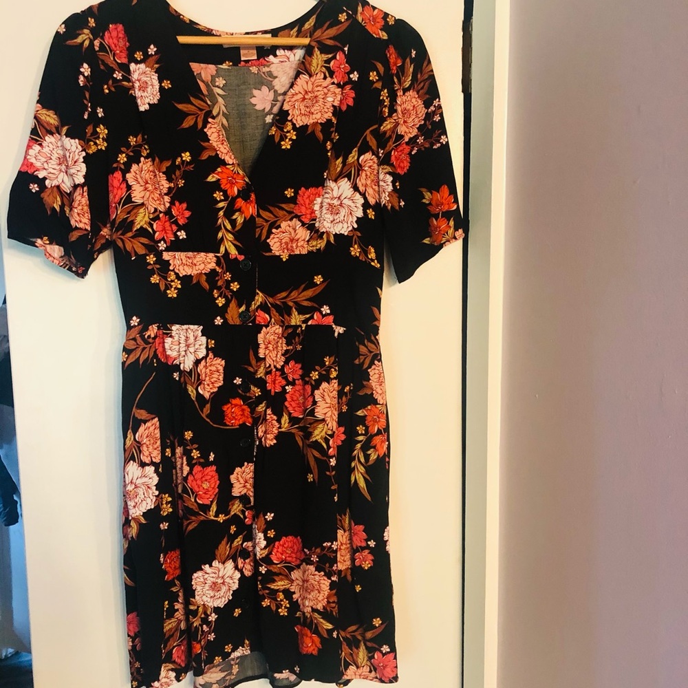 Dress. Mid thigh length. Cinched at the waist.